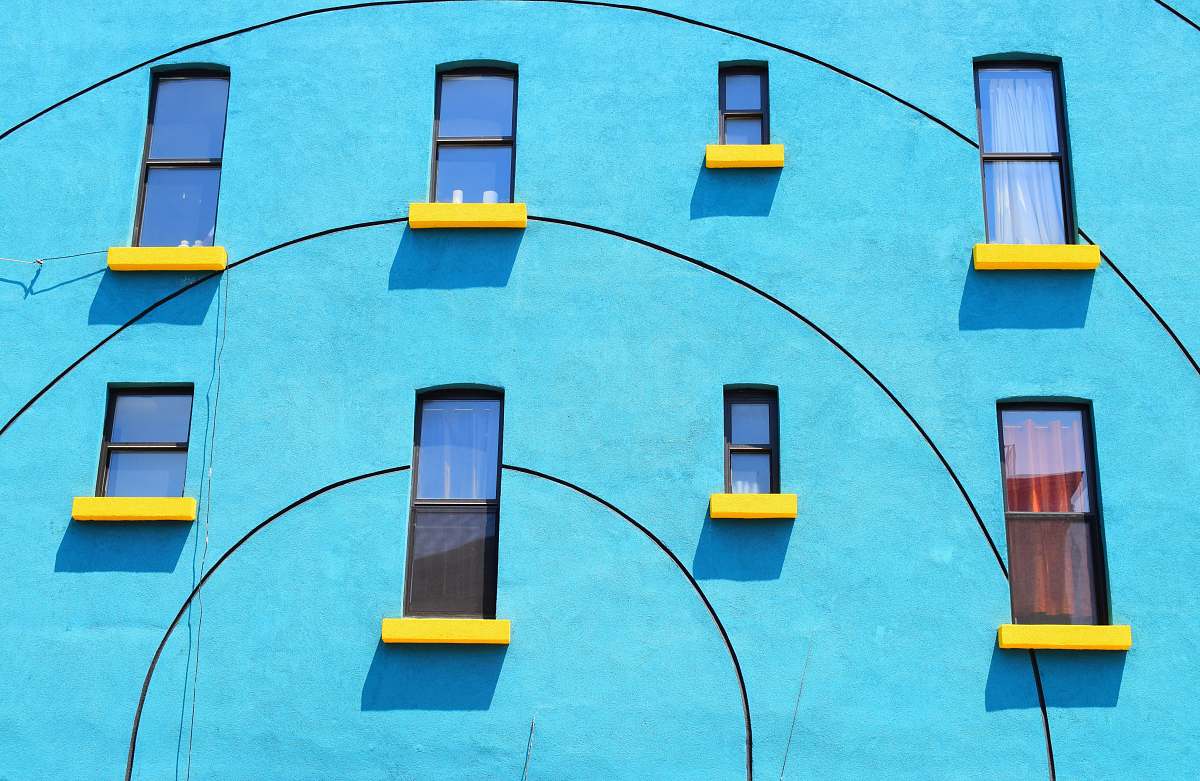 new york blue painted wall with eight windows blue